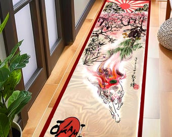 May include: A long, rectangular rug with a red border. The rug features a Japanese-inspired design with a white fox, cherry blossoms, bamboo, and a rising sun. The text "Okami" is printed in red on the rug.