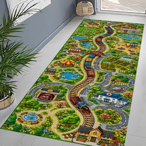 May include: A rectangular area rug featuring a colorful illustrated town map with a winding train track, roads, a hospital, a fire station, a playground, ponds, and green park spaces. The vibrant design includes various buildings and trees.