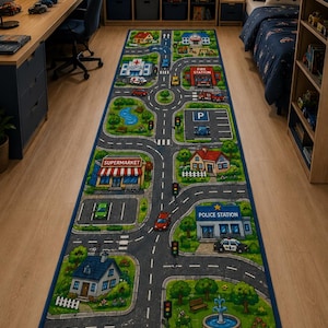 May include: A long rectangular area rug featuring a colorful printed city map design with roads, a hospital, a fire station, a police station, a supermarket, a gas station, houses, a park with a fountain, and various toy cars placed on the surface.