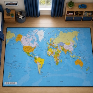 May include: A rectangular area rug featuring a colorful world map printed on a light blue background. The continents are depicted in various shades of yellow, orange, and purple, with the text THE WORLD printed in a white box in the bottom left corner.