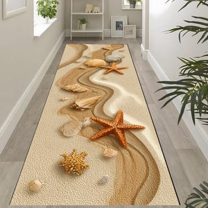 May include: A rectangular rug with a beach scene design. The rug features a sandy background with seashells and starfish in shades of tan, brown, and orange. The design creates a 3D effect, giving the impression of a real beach.