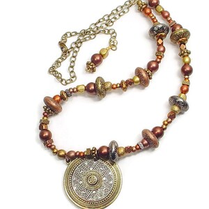SOLD. Necklace with Gold and Silver Colored Metal Circular Pendant and Patterned Metal Beads and Antiqued Bronze Colored Chain image 2