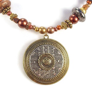 SOLD. Necklace with Gold and Silver Colored Metal Circular Pendant and Patterned Metal Beads and Antiqued Bronze Colored Chain image 1