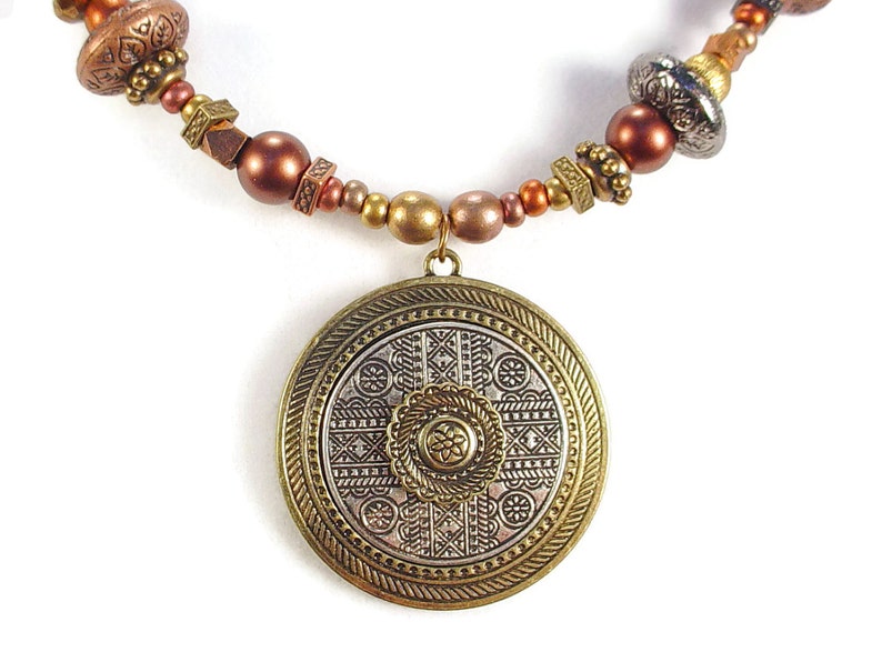 SOLD. Necklace with Gold and Silver Colored Metal Circular Pendant and Patterned Metal Beads and Antiqued Bronze Colored Chain image 1