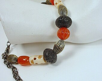Adjustable Bracelet with Skull Beads and Black Lava Rock and Carnelian Beads with Gunmetal