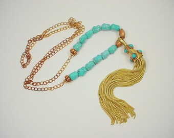 Price reduced..   Long Statement Necklace with Turquoise Studded Tassel and Turquoise Dogbone Beads on Torched Copper Chain