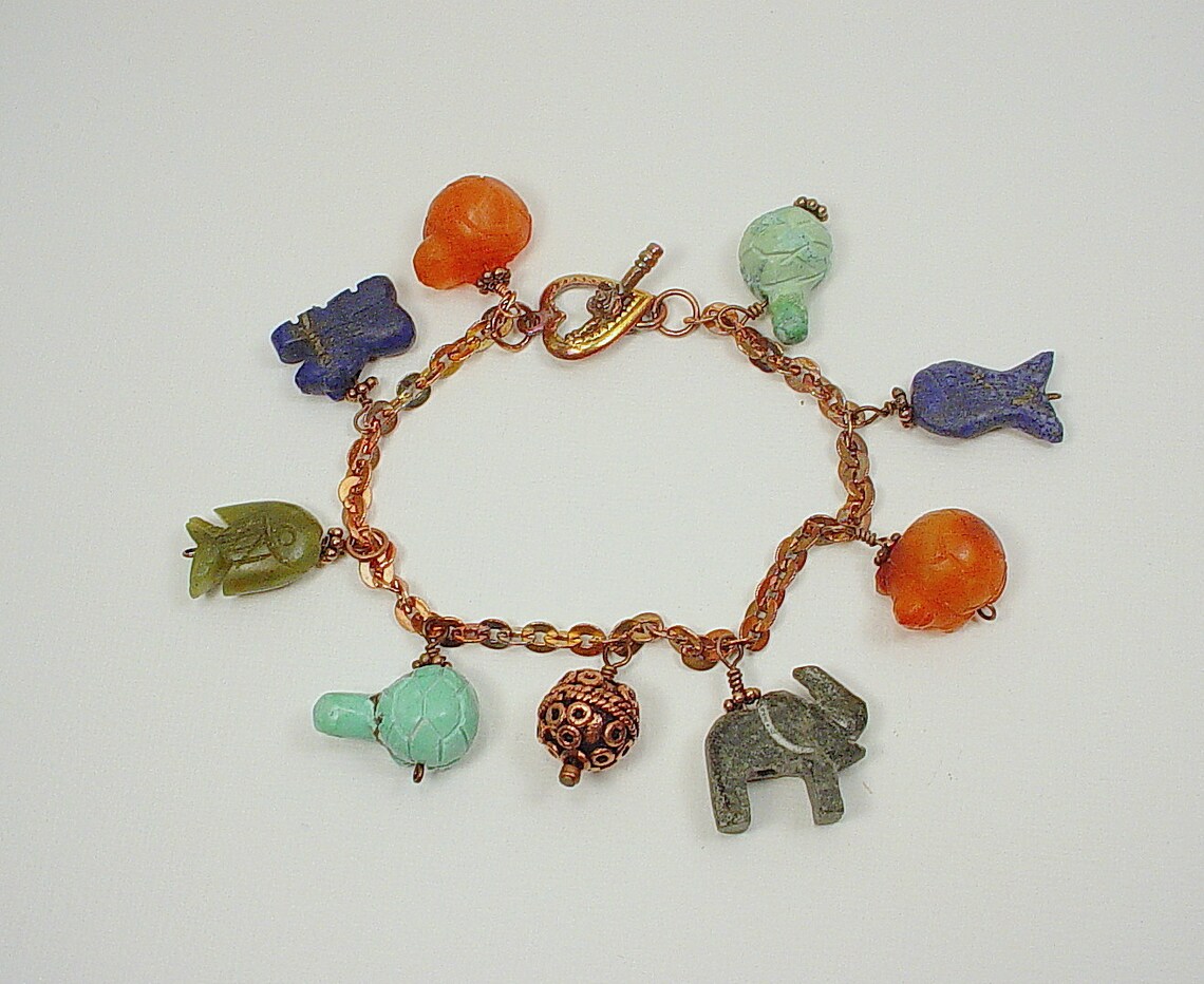 Bracelet With Afghan Handmade Animal Beads Including Lion, Fish