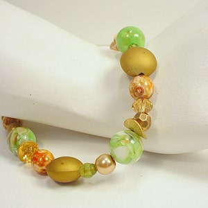 Bracelet with Crystal, Glass, Ceramic and Metal Beads in Tones of Green, Gold, and Brown with Magnetic Clasps image 1