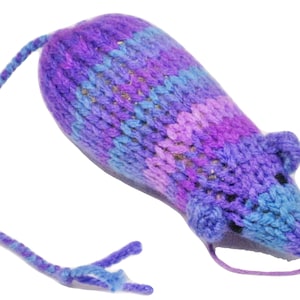 May include: A purple, blue, and pink knitted cat toy shaped like a mouse. The toy has a long tail and a bell inside.