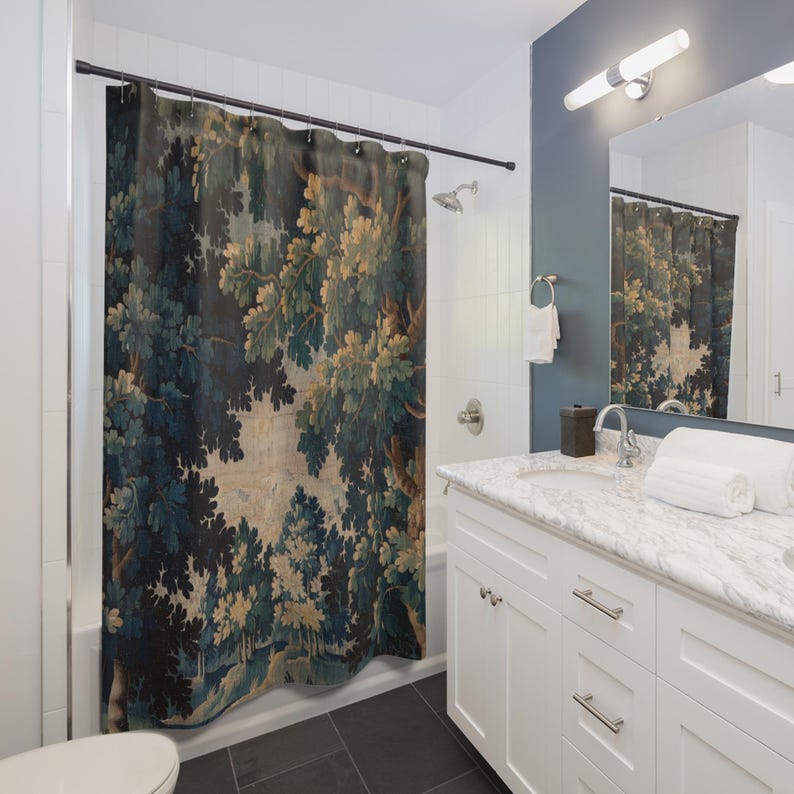 Add vintage charm to your bathroom with this stunning shower curtain, featuring a reproduction of an 18th-century Aubusson verdure tapestry. The lush woodland scene brings antique elegance to your bathroom decor, making it a perfect centerpiece for any bathroom renovation. Crafted from high-quality fabric, this bath curtain combines historic beauty with everyday functionality. Elevate your home decor with this unique tapestry-inspired bathroom accessory.