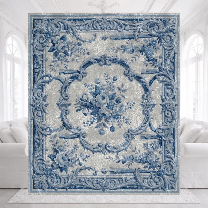 Luxury crushed velvet throw blanket featuring an antique-inspired vintage French Aubusson blue and white floral Marie Antoinette design. Soft, fluffy, comfy and cozy, this heritage design elevates home decor in any bedroom or living room. Style it on a sofa, as a bed cover or bedspread in traditional, grandmillennial, French country, or shabby chic interiors. A refined gift for art lovers.