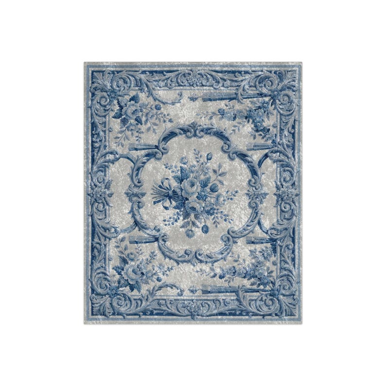 Luxury crushed velvet throw blanket featuring an antique-inspired vintage French Aubusson blue and white floral Marie Antoinette design. Soft, fluffy, comfy and cozy, this heritage design elevates home decor in any bedroom or living room. Style it on a sofa, as a bed cover or bedspread in traditional, grandmillennial, French country, or shabby chic interiors. A refined gift for art lovers.