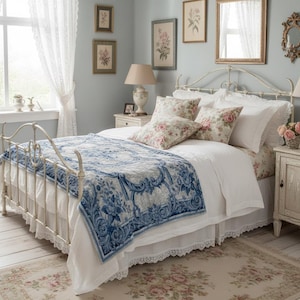 Luxury crushed velvet throw blanket featuring an antique-inspired vintage French Aubusson blue and white floral Marie Antoinette design. Soft, fluffy, comfy and cozy, this heritage design elevates home decor in any bedroom or living room. Style it on a sofa, as a bed cover or bedspread in traditional, grandmillennial, French country, or shabby chic interiors. A refined gift for art lovers.