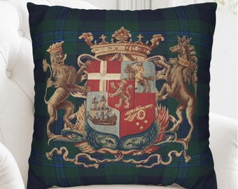 May include: A square throw pillow featuring a dark green and navy blue plaid pattern. Centered on the pillow is a detailed heraldic coat of arms with a crown, a lion, a horse, a ship, a cannon, and a knight on horseback in red and gold.