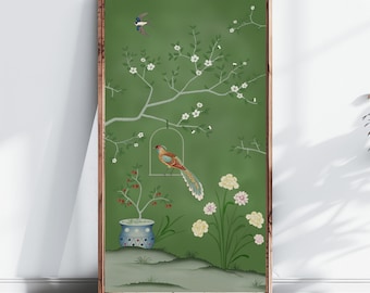 May include: A framed green and white floral print with a bird in a cage and a potted plant. The print features a green background with white flowers and a bird in a cage. The bird is brown, orange, and blue. The potted plant is blue and white.