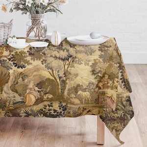 May include: A rectangular tablecloth with a pastoral scene in shades of beige, brown, and green. The design features figures, trees, and animals. The tablecloth is draped over a wooden table, with white plates, cups, and a vase of flowers.
