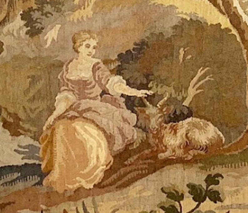 Bring timeless charm to your home with this 19th-century French verdure garden tapestry wall hanging. Featuring pastoral scenes, elegant figures, and lush foliage, this antique-style Aubusson piece adds a grandmillennial touch to any room. Perfect for French country, cottagecore, or vintage decor. Ideal for a living room, bedroom, or hallway. A statement piece for lovers of historic wall art, tapestries, and château interiors.