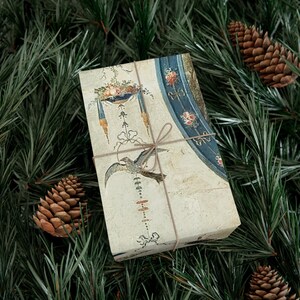 Wrap your presents this Christmas holiday season in elegance with this vintage French chateau neoclassical design. Featuring intricate details, this antique-style wrap adds sophistication to any gift packaging. Perfect for DIY projects, scrapbooking, art supplies, and crafting, this high-quality paper roll enhances any occasion with its timeless charm. Elevate your gift wrap with historic beauty and luxurious packaging.