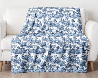 Manta de felpa francesa estilo campestre azul y blanca con estampado Toile de Jouy, suave y acogedora, ideal para la decoración del hogar con un toque vintage o como regalo de invierno.