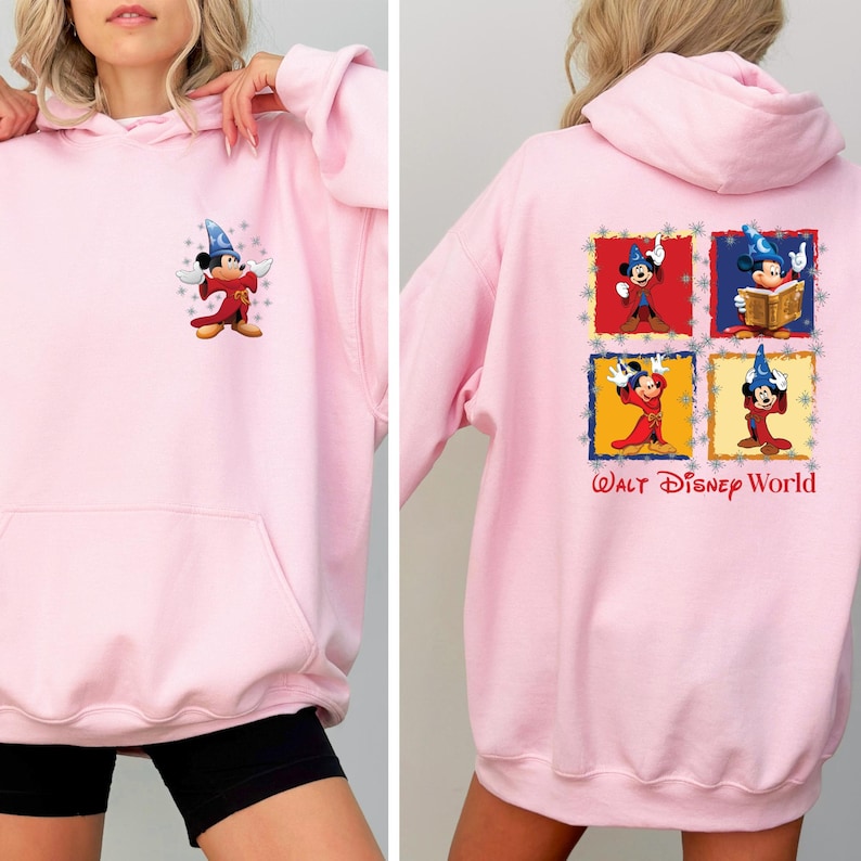 May include: Pink hooded sweatshirt with a Mickey Mouse illustration on the front and a multi-panel Mickey Mouse illustration on the back. The back illustration includes the text "WALT DISNEY WORLD".