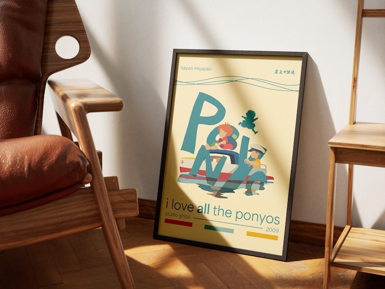 May include: A yellow poster with a stylized illustration of a boat with two people on it. The text on the poster reads "Ponyo" in large letters, "Hayao Miyazaki" in smaller letters, and "i love all the ponyos" in a smaller font. The poster is framed in black.