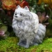 pomeranian statue with wings