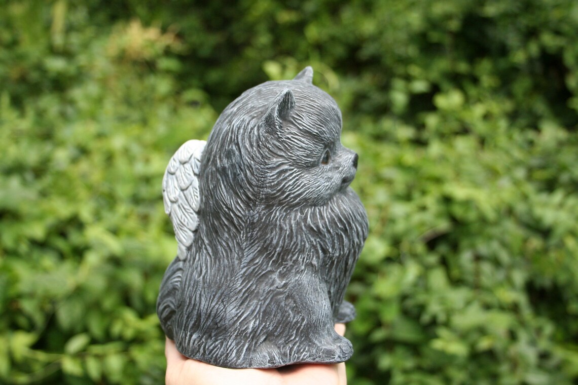 pomeranian statue with wings