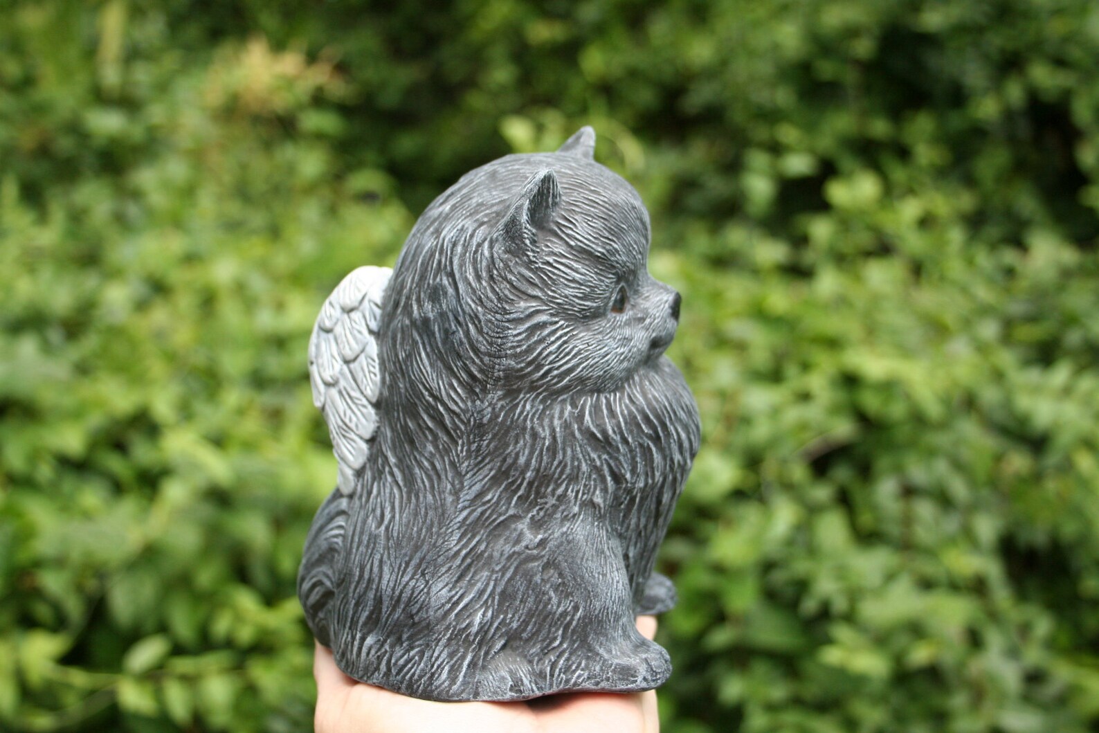 pomeranian statue with wings