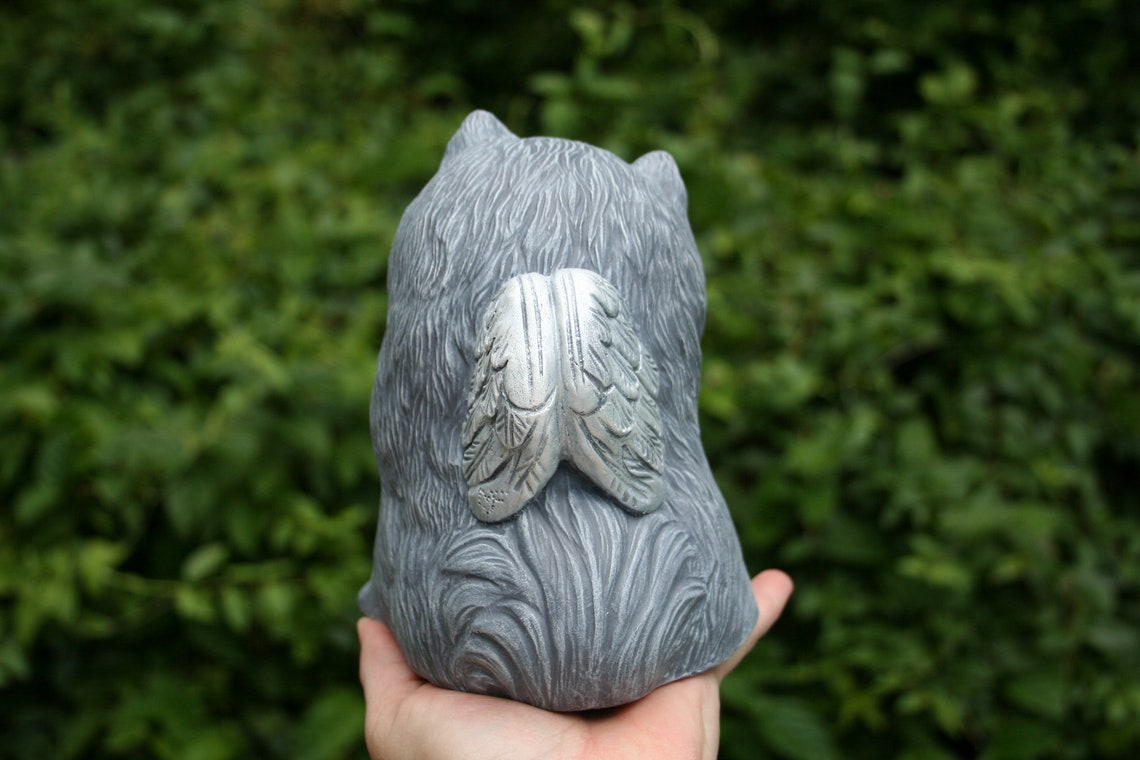pomeranian statue with wings