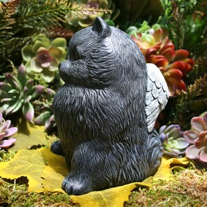 pomeranian statue with wings