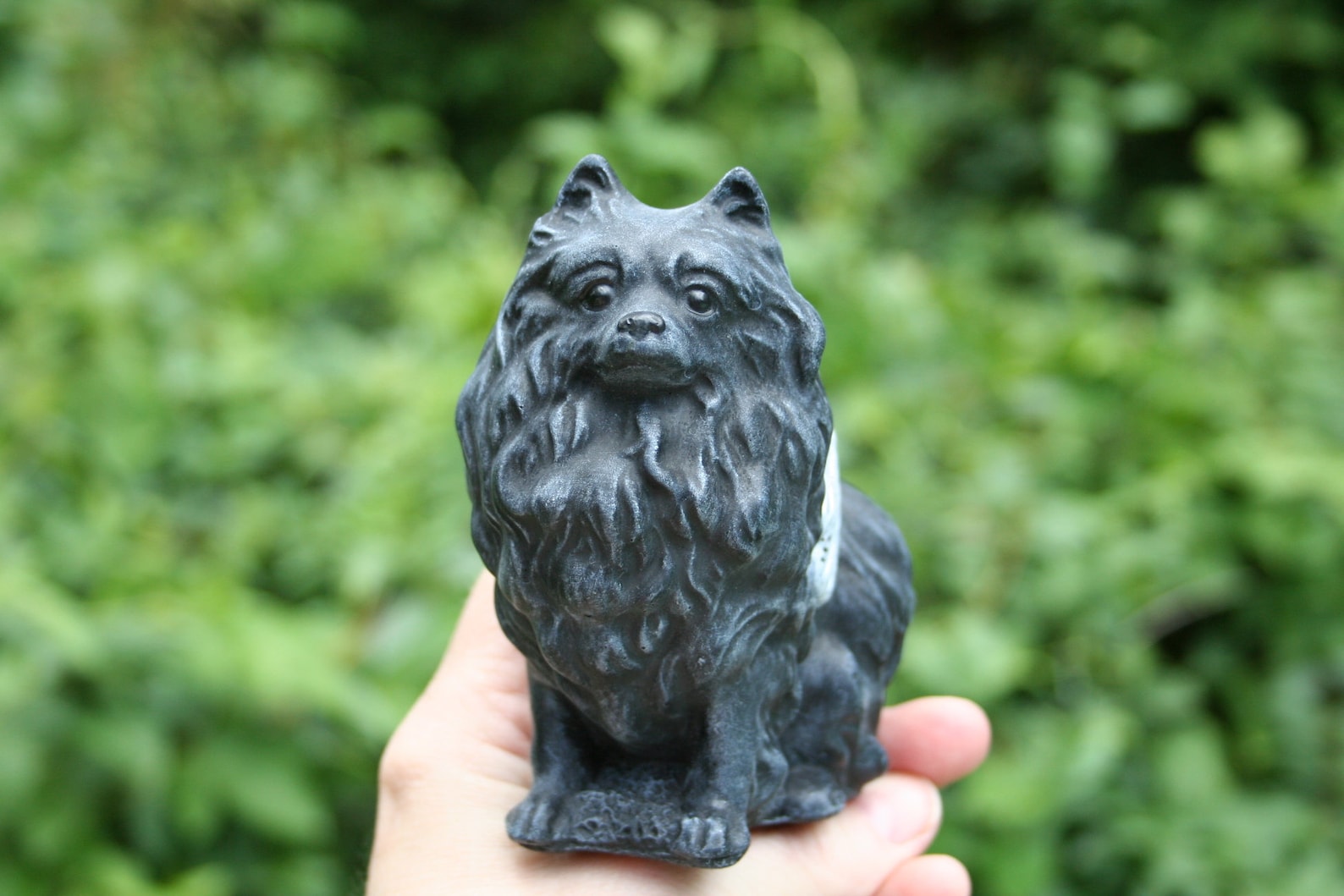 pomeranian statue with wings