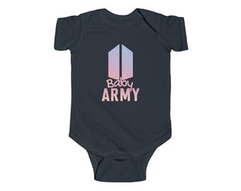 May include: A dark charcoal grey baby bodysuit featuring a graphic of a vertical shield icon with a pink and blue gradient. Below the icon, the text Baby ARMY is printed in a light pink font. The garment has short sleeves and a round neckline.