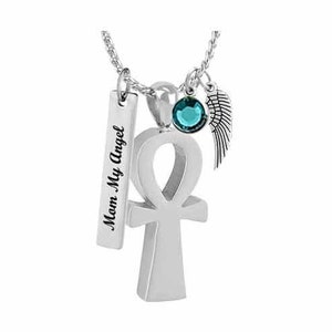 May include: Silver pendant necklace with an ankh charm, a small teal crystal, and a wing charm. The pendant has a rectangular tag that reads "Mom My Angel".