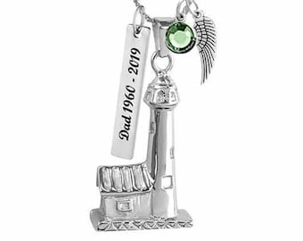 May include: Silver lighthouse pendant necklace with a green crystal, a small angel wing charm, and a personalized tag that reads "Dad 1960 - 2019".
