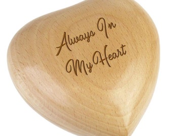 May include: A wooden heart-shaped box with the inscription "Always in My Heart" engraved on the front.