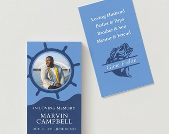 May include: A blue and white memorial card with a photo of a man in a blue jacket and a yellow shirt. The card has a nautical theme with a ship's wheel and waves. The text reads "In loving memory, Marvin Campbell, Oct. 14, 1951 - June 10, 2023". A second card reads "Loving Husband, Father & Papa, Brother & Son, Mentor & Friend, Gone Fishin'".