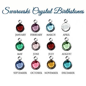 May include: Twelve Swarovski crystal birthstones, one for each month of the year. The crystals are set in silver-toned metal settings and are arranged in three rows of four. The months are labeled below each crystal.