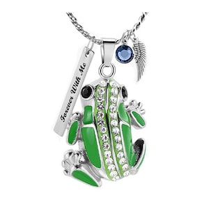 May include: A silver necklace with a green frog pendant, a blue crystal charm, and a silver charm with the words "Forever With Me".