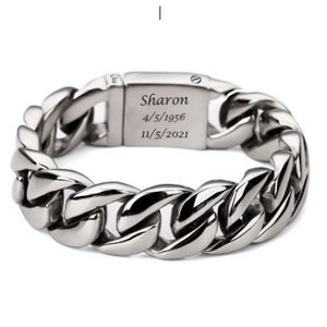 May include: Silver chain bracelet with a personalized inscription that reads "Sharon 4/5/1956 11/5/2021".