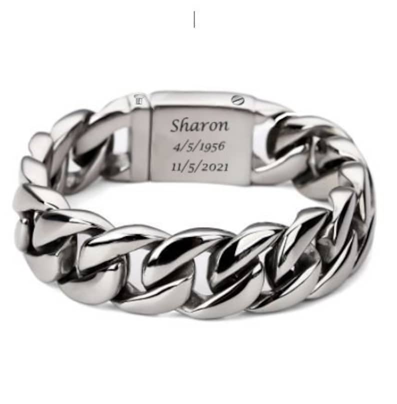 May include: Silver chain bracelet with a personalized inscription that reads "Sharon 4/5/1956 11/5/2021".
