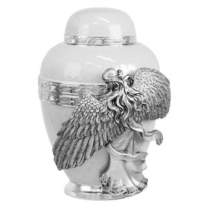 May include: White ceramic urn with a silver angel figurine on the side. The angel has wings and flowing hair.