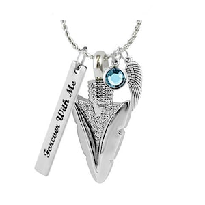 May include: Silver necklace with a silver arrowhead pendant, a small angel wing charm, and a blue crystal charm. The pendant has the words "Forever With Me" engraved on a silver tag.