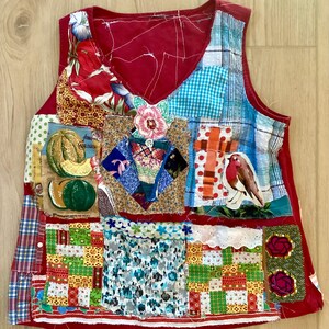 May include: A patchwork vest with a V-neck design. The vest features a variety of fabric patterns, including floral, plaid, and geometric designs. The color palette includes red, blue, green, and yellow. The vest has a unique, handcrafted appearance.