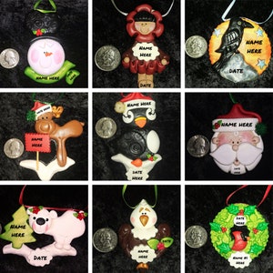 May include: Nine handmade Christmas ornaments featuring various winter characters, including a snowman, penguin, reindeer, Santa Claus, and a bird. Each ornament has a blank space for a name and date.