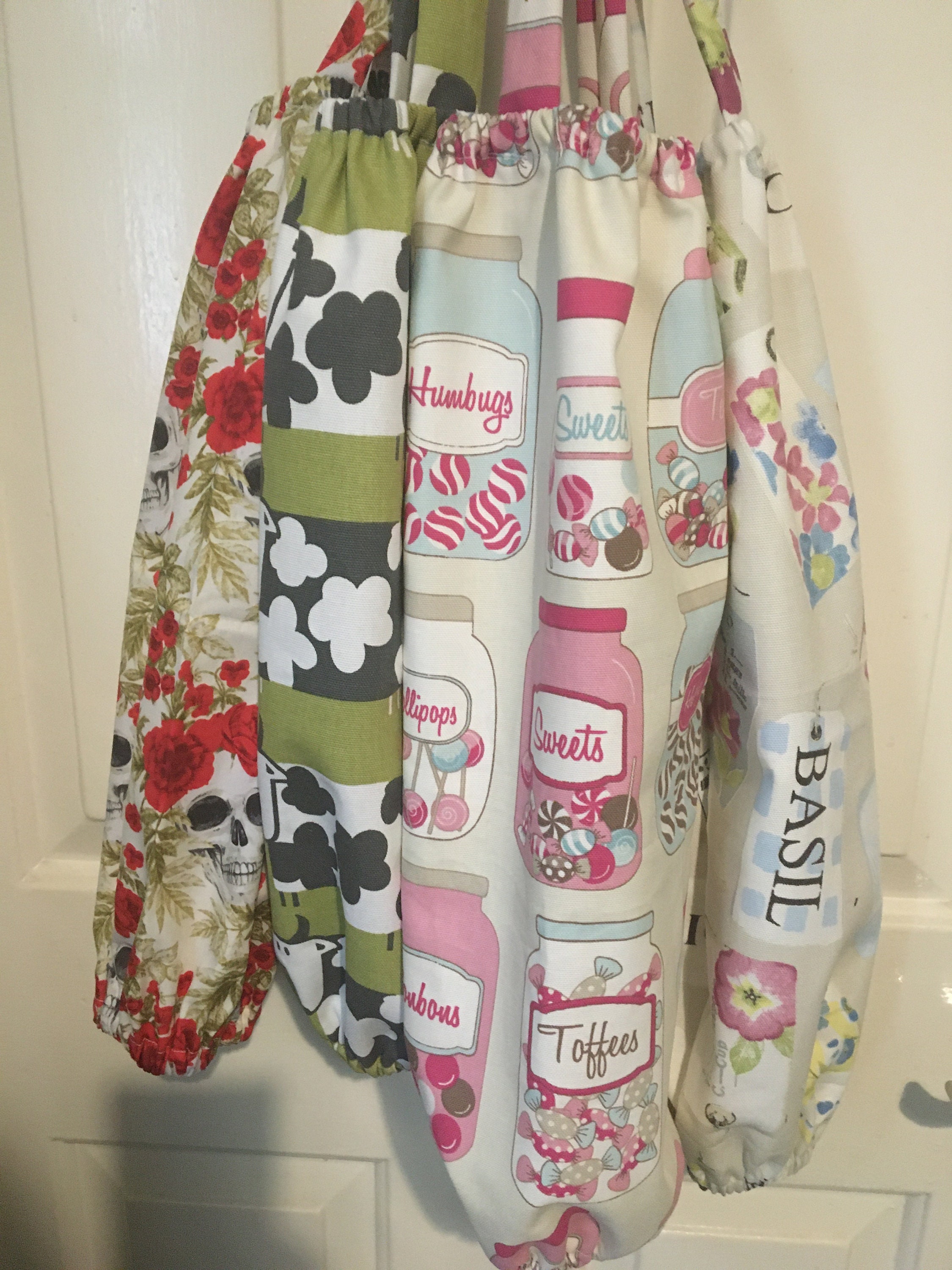 A handmade rustic carrier bag storage fabric tidy holder with cows printed on it