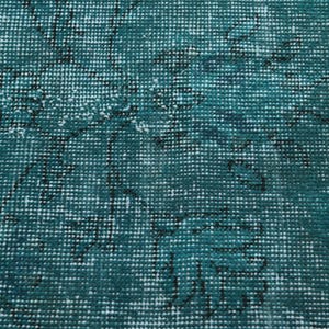 May include: Teal blue rug with a woven pattern of white and black lines. The rug has a distressed look, giving it a vintage feel.