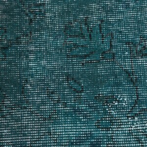 May include: Teal blue fabric with a woven pattern. The fabric has a subtle, faded design.