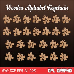May include: Wooden alphabet puzzle keychains with each letter of the alphabet on a separate puzzle piece. The pieces are brown and have a natural wood finish.
