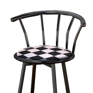 May include: Black metal bar stool with a checkered black and white padded seat and a curved backrest.