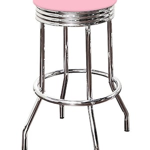 May include: A retro-style bar stool with a pink seat and a chrome-plated steel frame. The stool has a circular seat, a footrest, and four legs. The seat is approximately 12 inches in diameter.